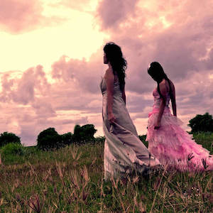 Two women walking in a field