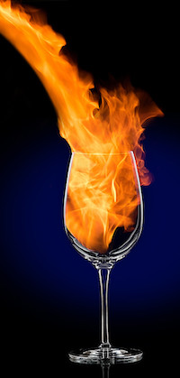 Flames being poured into a wine glass