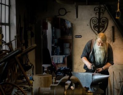Picture of a metal worker in his shop